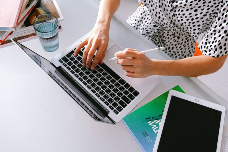 Woman typing on laptop